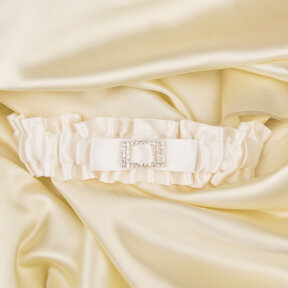 ivory satin bridal garter with a diamante buckle centre