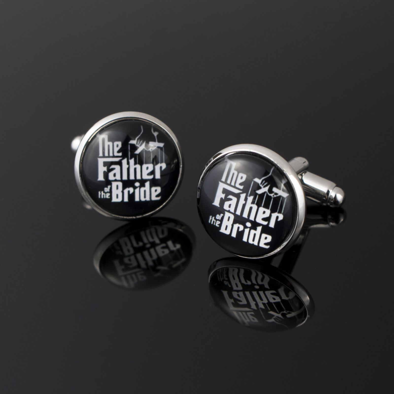 round black cufflinks resembling the look of the godfather movie cover with the father of the bride words written in white