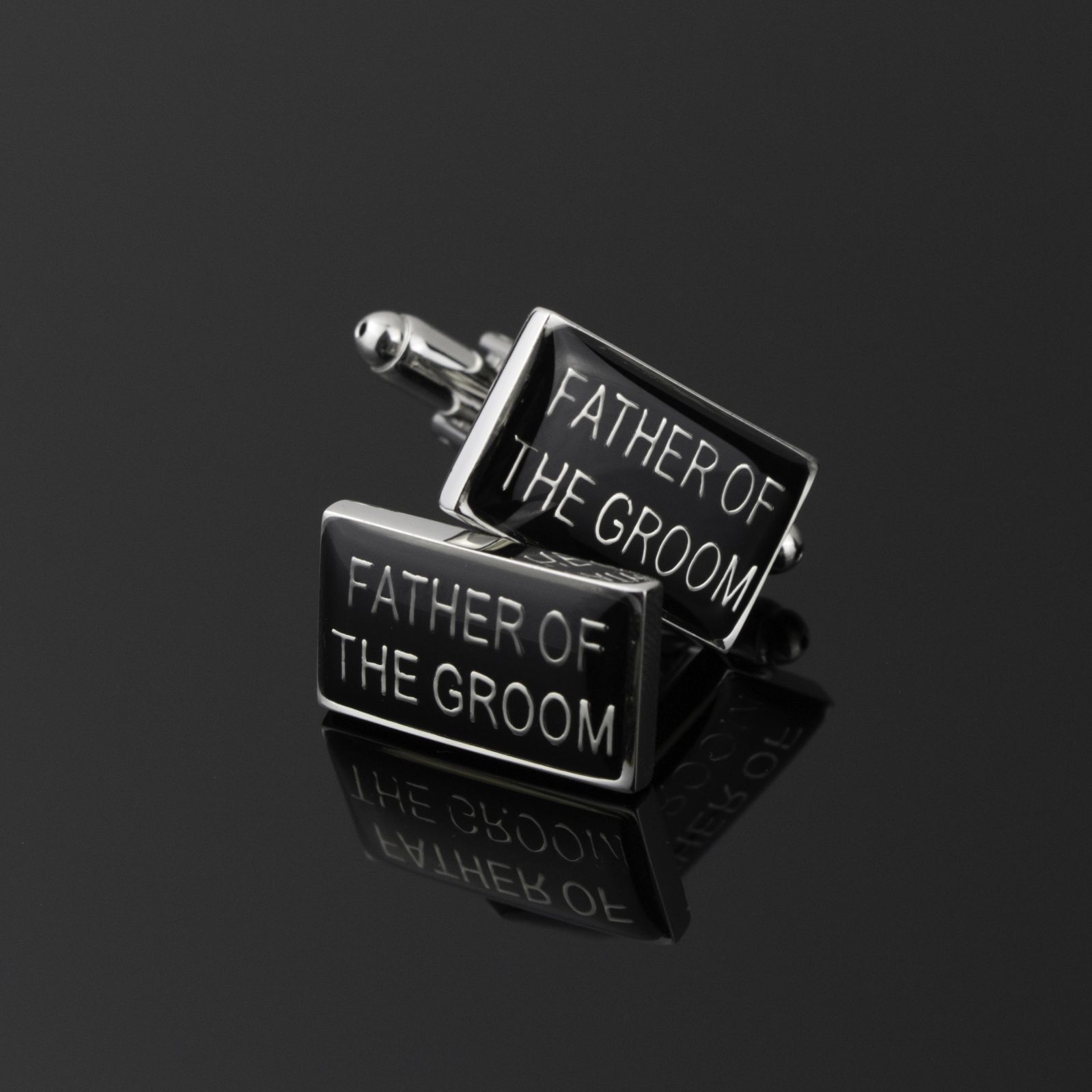 black rectangle cufflinks with silver trim and silver father of the groom uppercase words